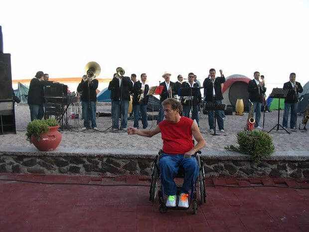 Conducting the Mariachis on his patio during Semana Santa, go anywhere chair