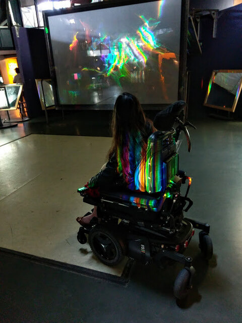 More mirrors! This time to channel light from the ceiling and contort it into a shape-shifting rainbow.