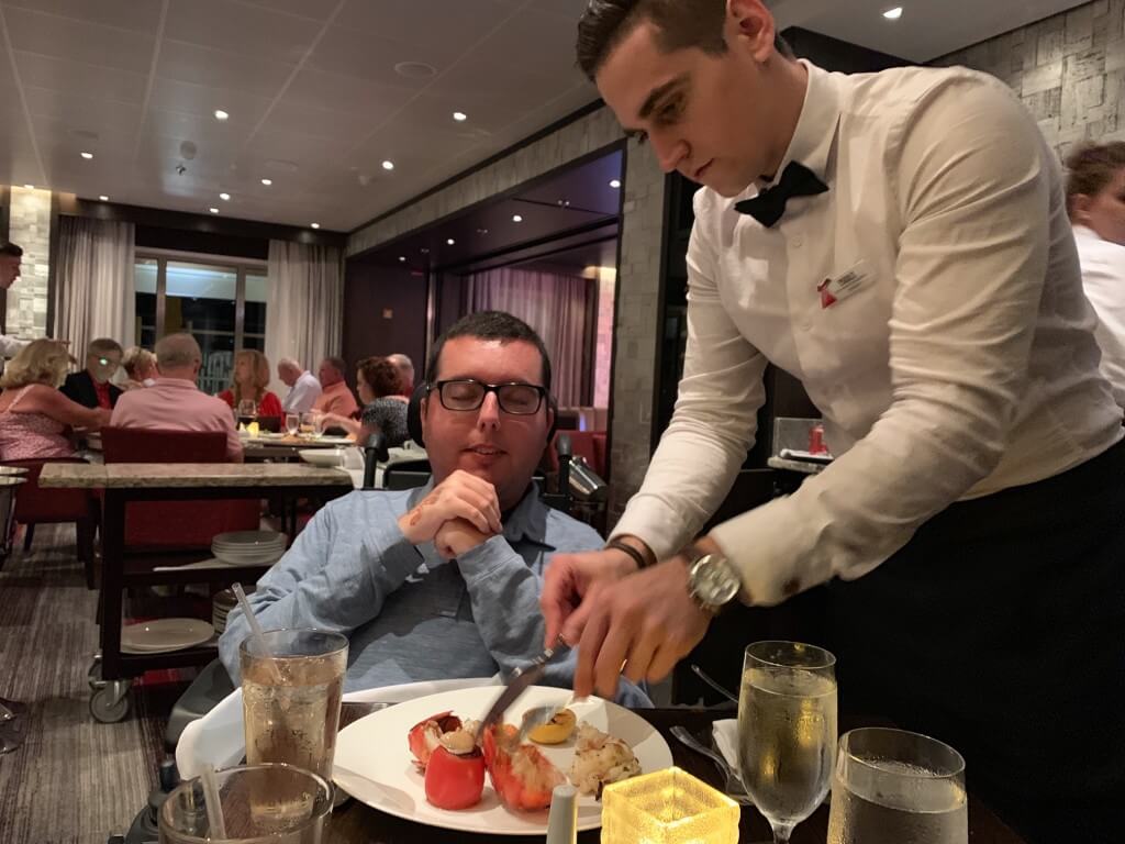 The staff at Fahrenheit 555 helping me cut my lobster.