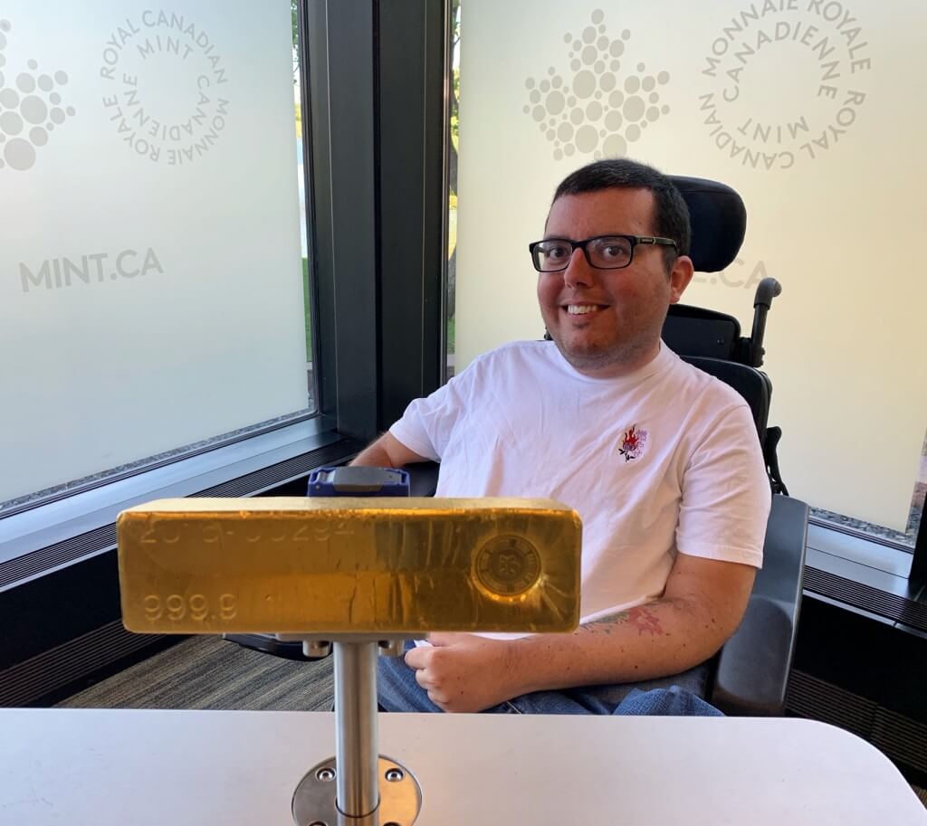 With a real gold bar at The Mint